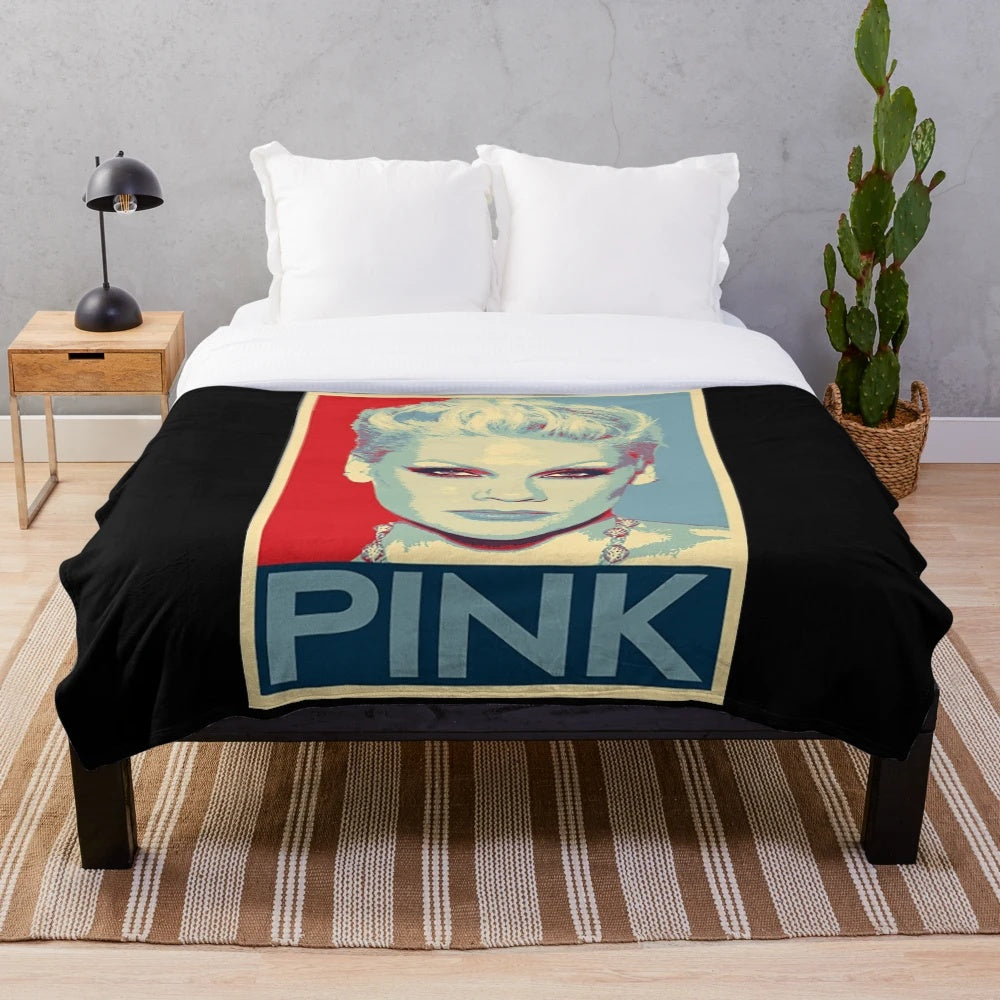 Pink plush blanket with a stylish design, perfect for music and pop culture fans