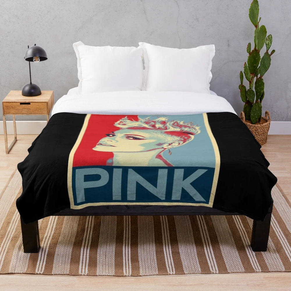 Cozy pink plush blanket with a subtle "Beautiful Trauma" inspired design