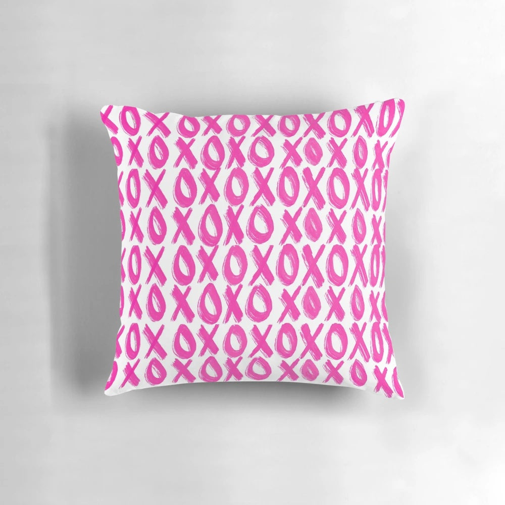 Soft, plush pink pillow with a delicate xoxo print design