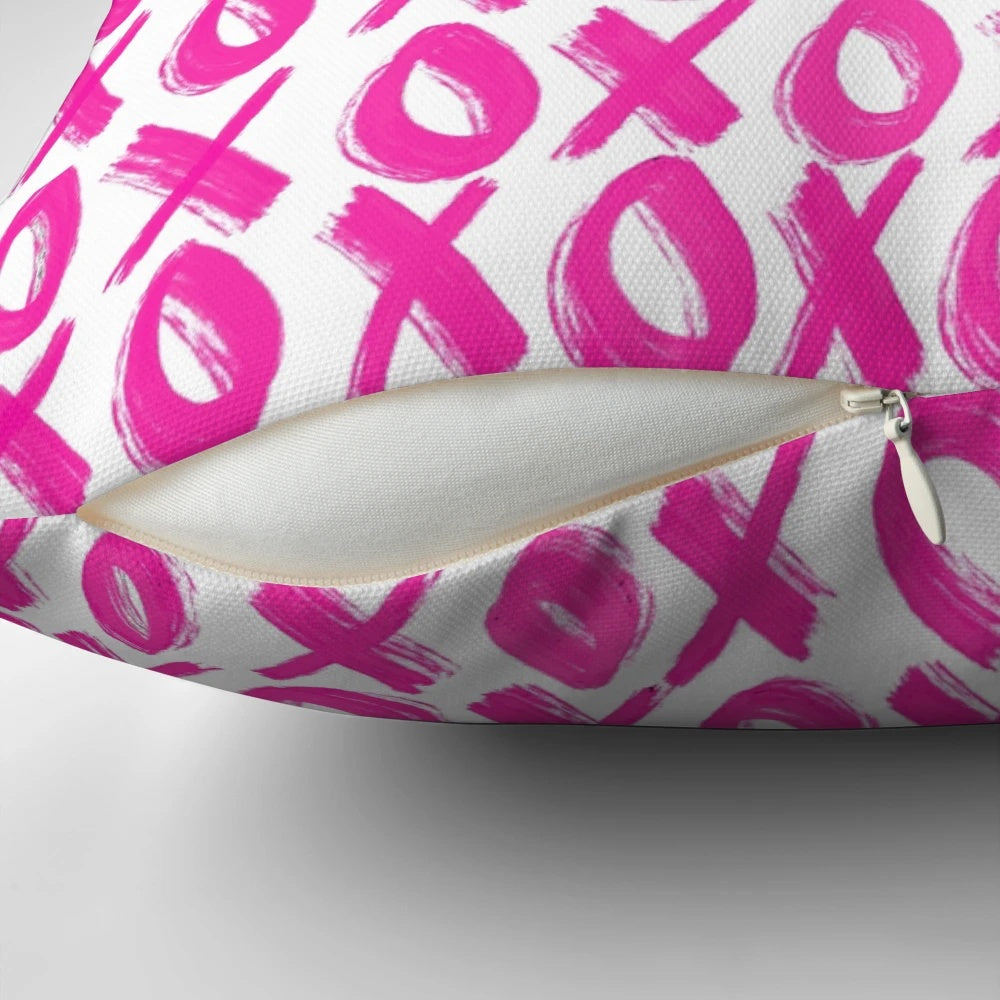 Soft, plush pink pillow with a delicate xoxo print design