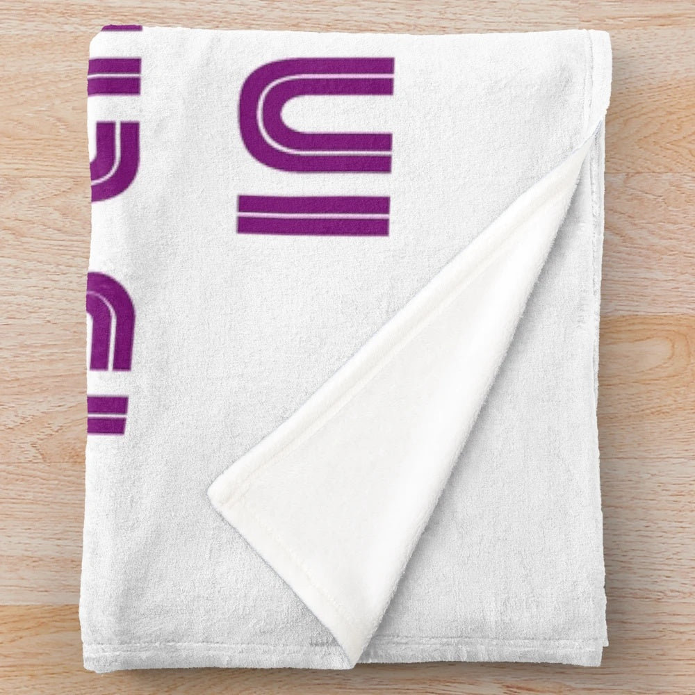 Plush designer blanket with vibrant and symmetrical pattern