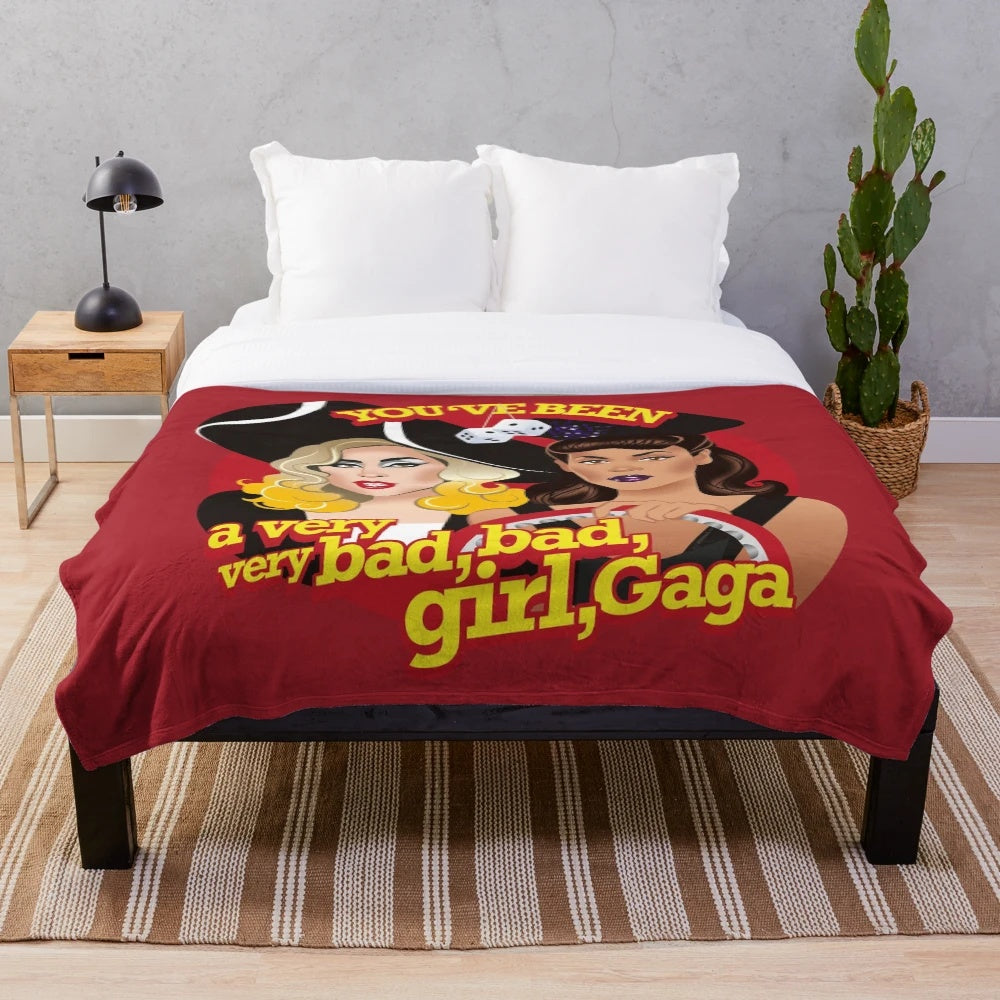 A plush blanket featuring Alejandro Mogolloart's pop art design of a stylish bad girl diva