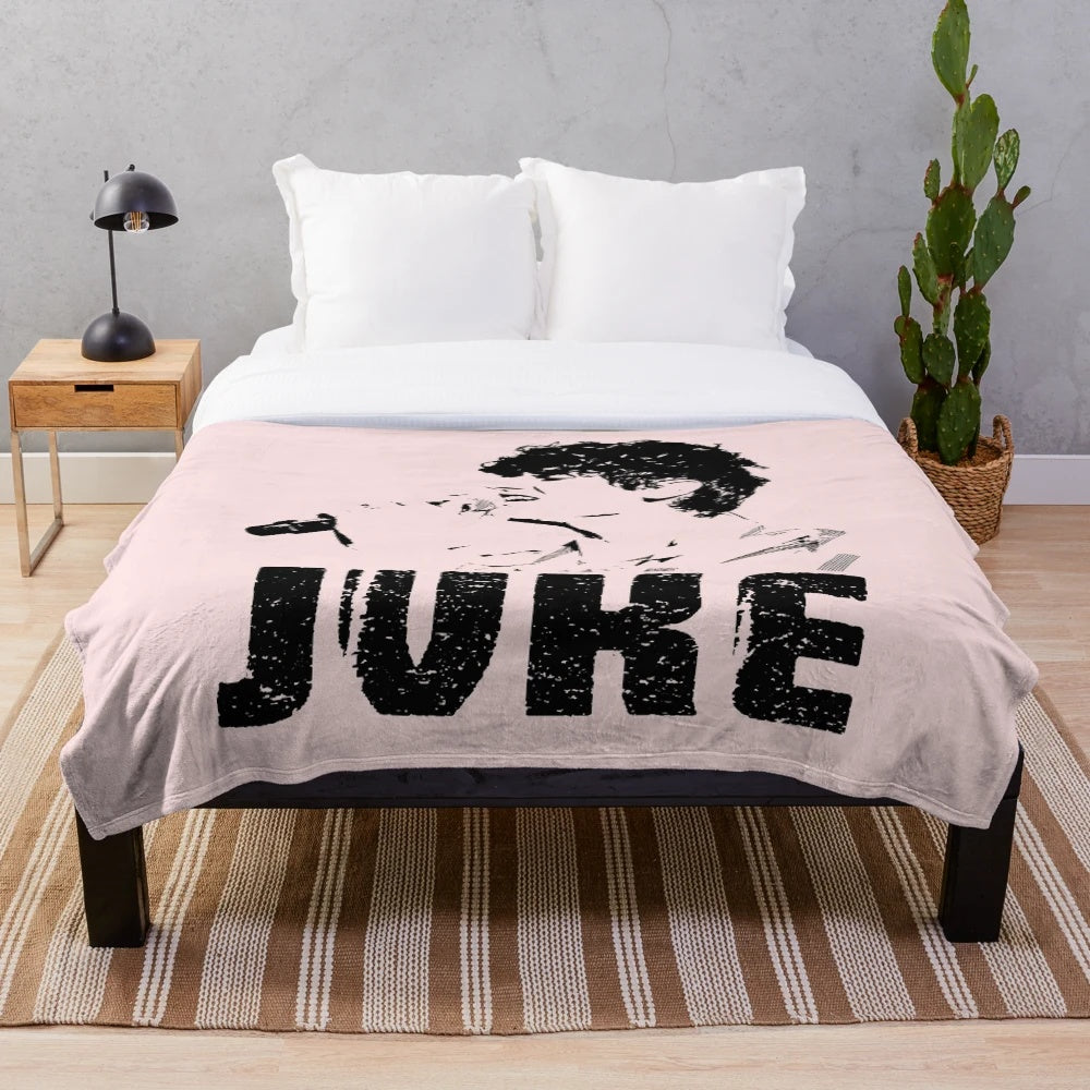 Plush blanket featuring the design of music artist JVKE