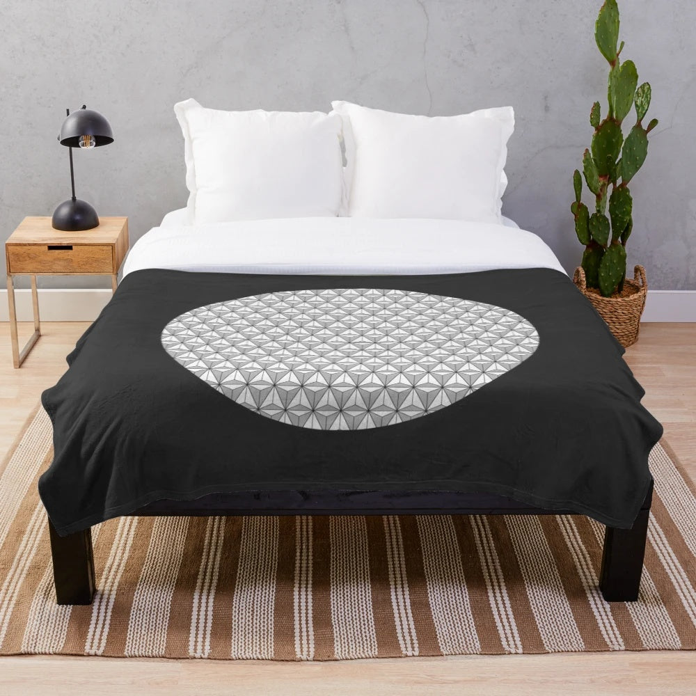 Stylish plush blanket featuring a geometric spaceship earth design