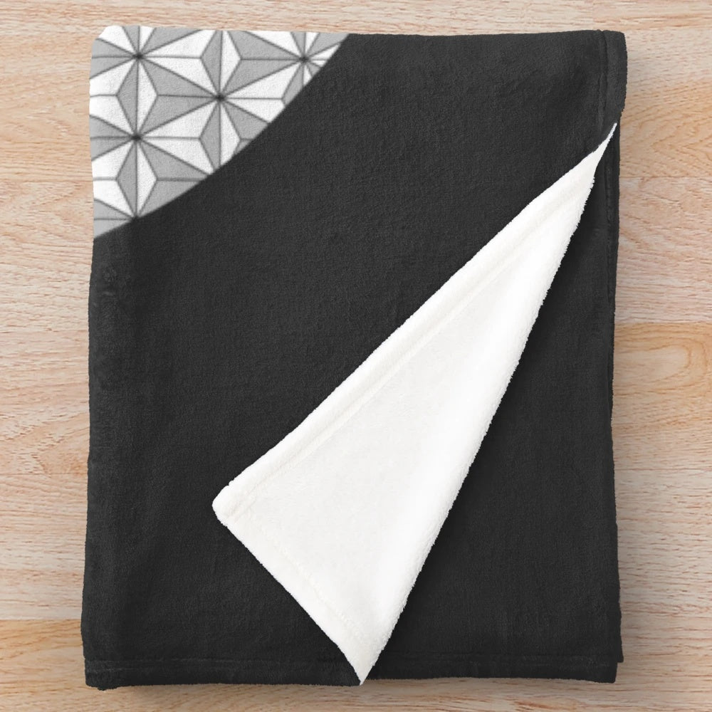 Stylish plush blanket featuring a geometric spaceship earth design