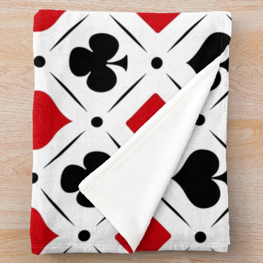 Plush blanket with playing card suits symbols and geometric patterns