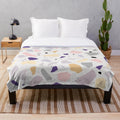 Plush blanket with colorful terrazzo design