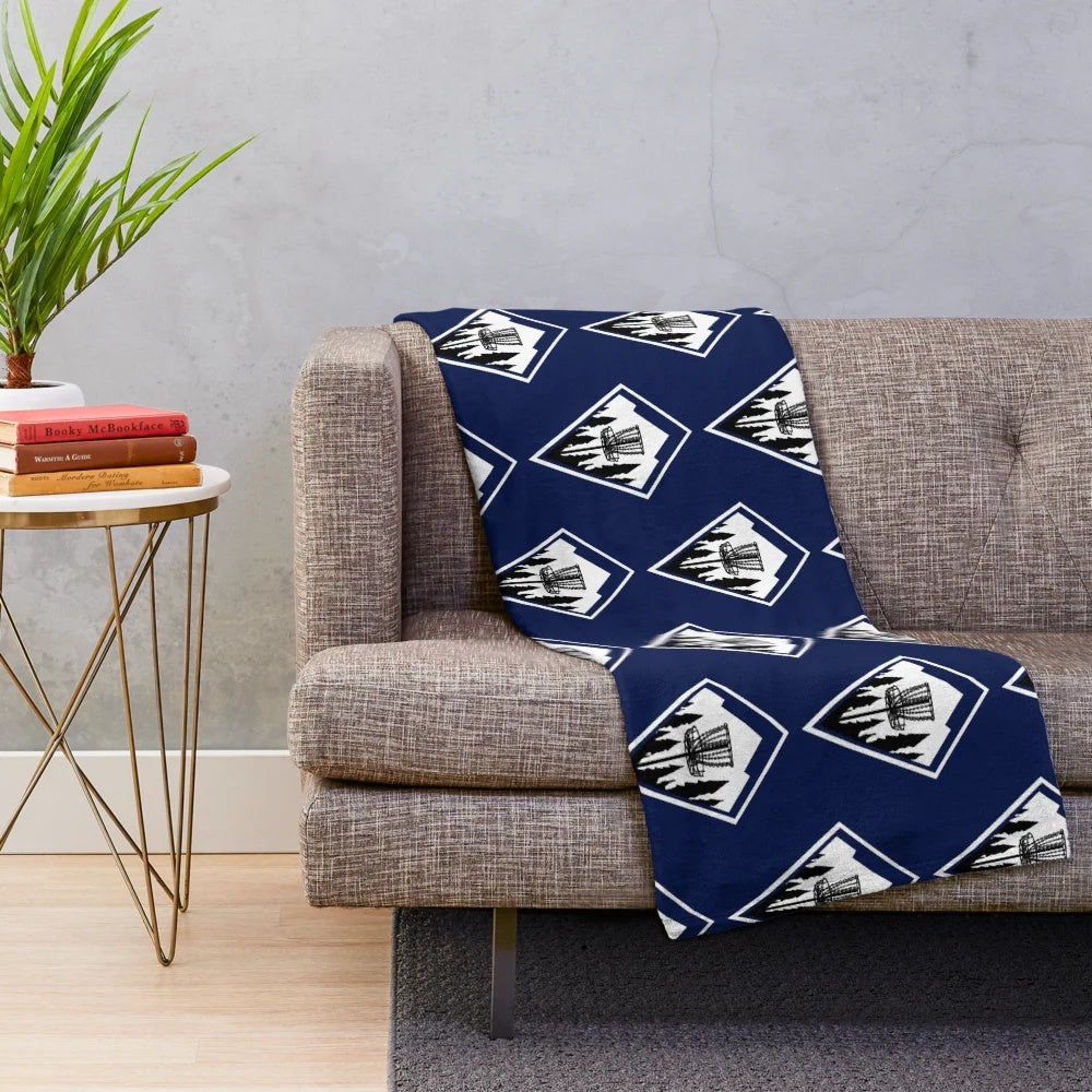 Plush disc golf themed blanket with geometric mountain design