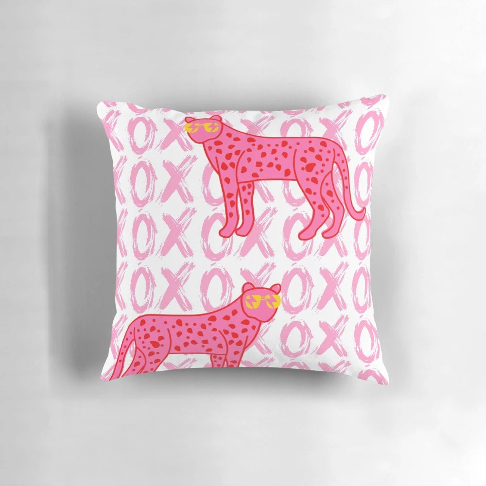 Decorative pillow featuring a cheetah print with a stylish, preppy design