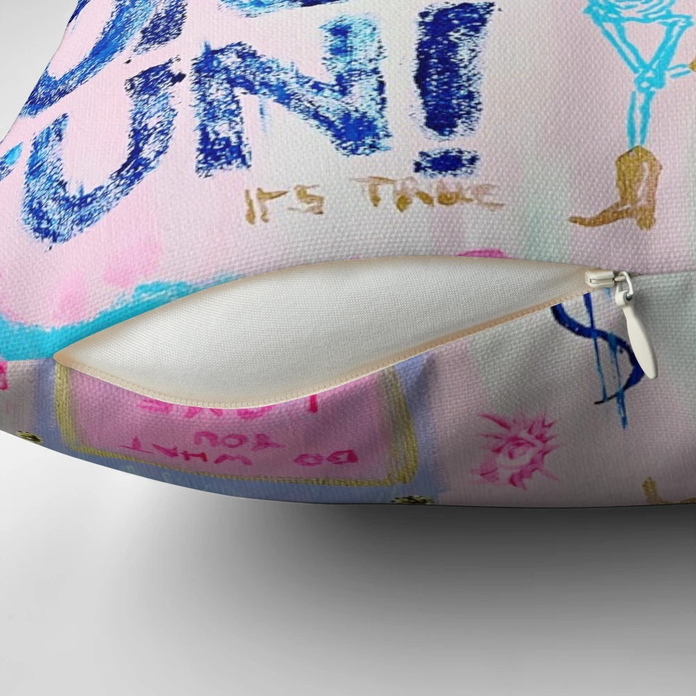 Decorative pillow with pink, blue, and gold accents in a preppy-inspired design.