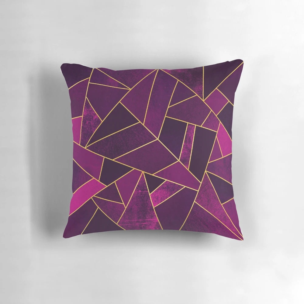 Purple and gold geometric patterned pillow