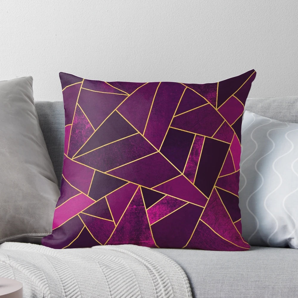Purple and gold geometric patterned pillow