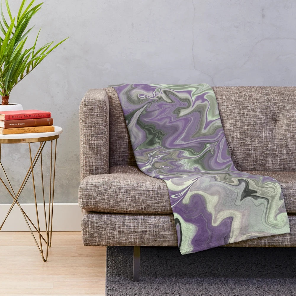 Purple and sage plush blanket with abstract zigzag and swirl pattern