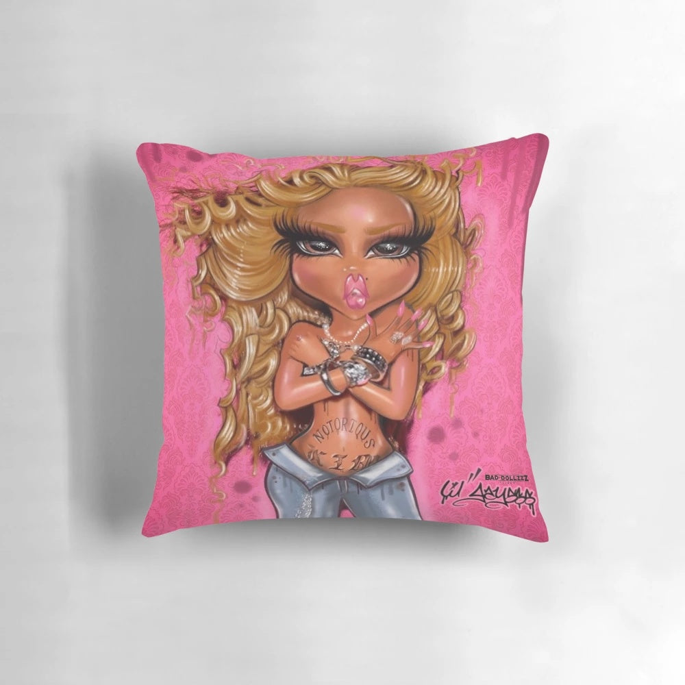Decorative pillow featuring a vibrant, hand-drawn Queen Bad Dollzzz character design in pink and black.