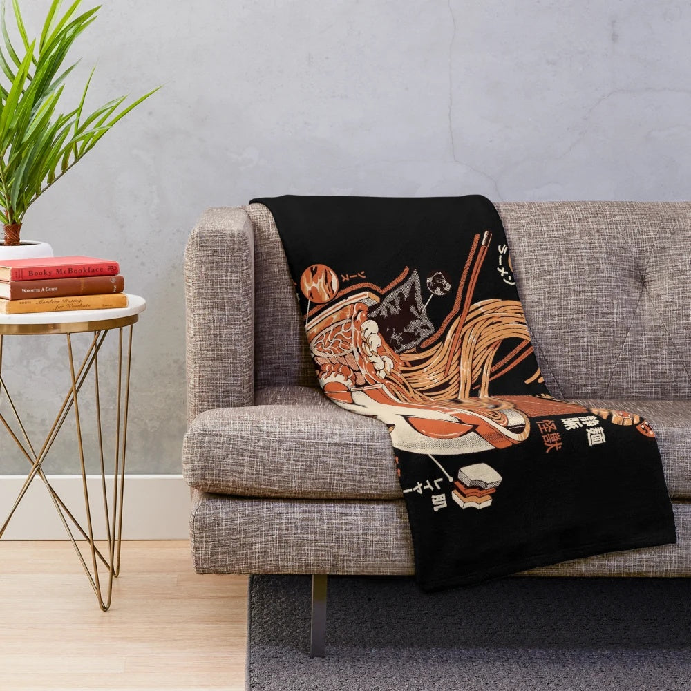 Plush blanket featuring a ramen-inspired kaiju design