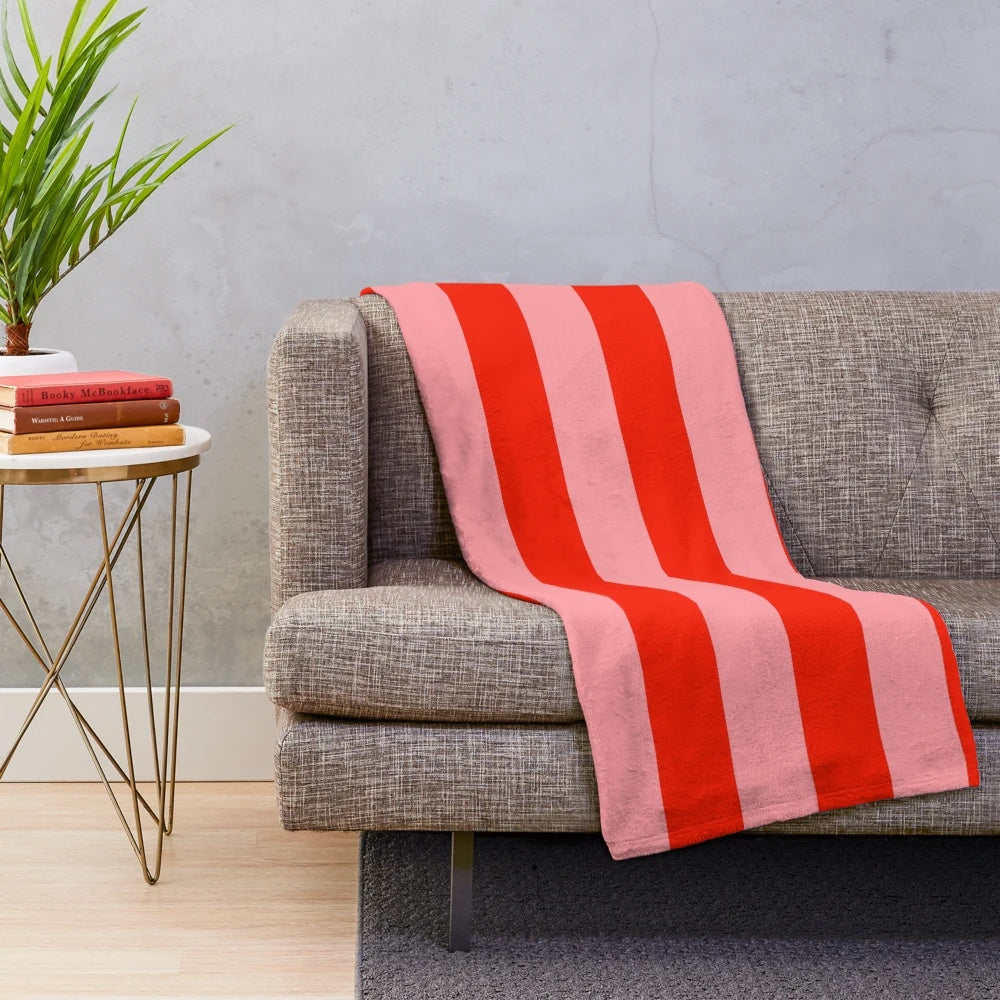 Soft, cozy red and pink striped plush blanket