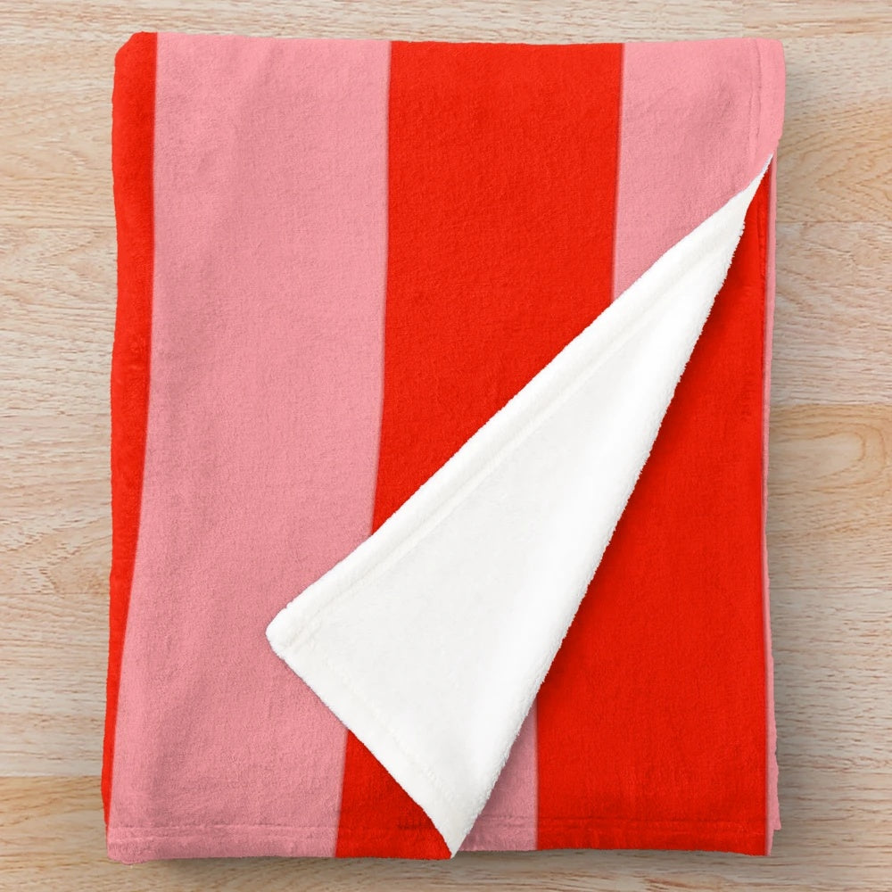 Soft, cozy red and pink striped plush blanket