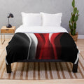 Red and white plush blanket with abstract pattern design