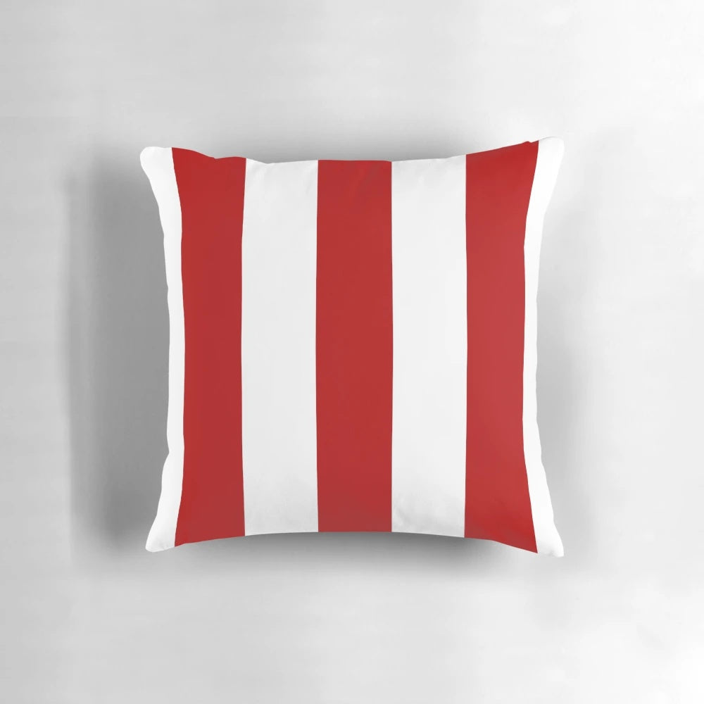 Red and white striped decorative pillow with a nautical, coastal design