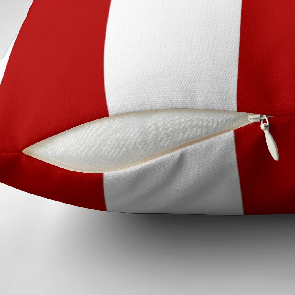 Red and white striped decorative pillow with a nautical, coastal design