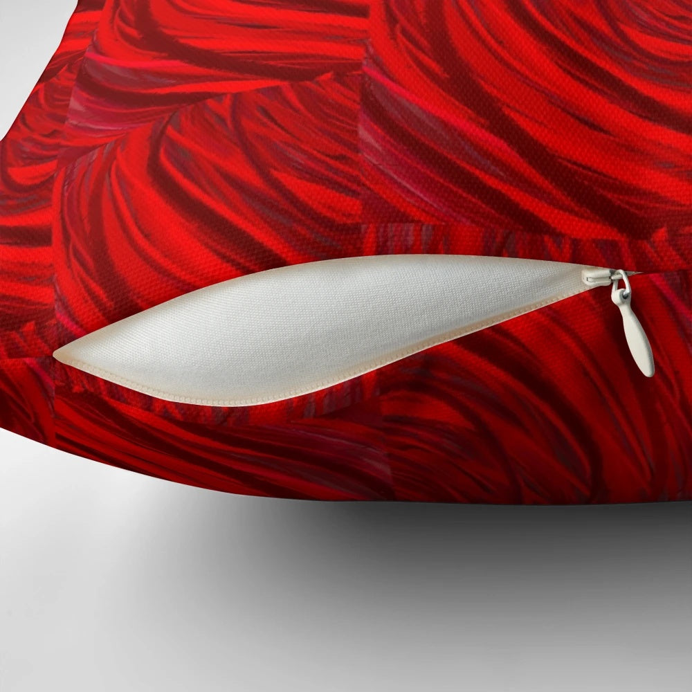 A red and maroon decorative pillow with abstract brush stroke patterns, perfect for adding a modern touch to any room.