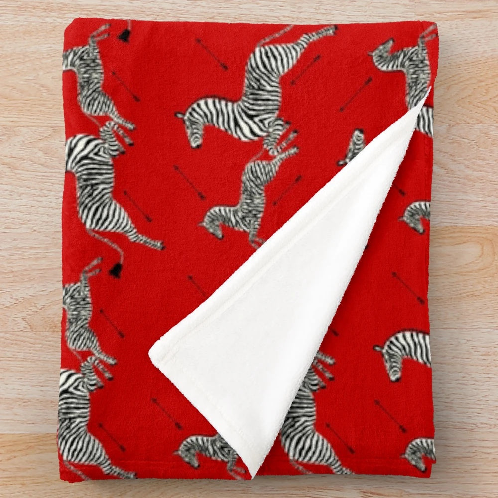 Red zebra print plush blanket inspired by Wes Anderson's The Royal Tenenbaums