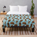 Redbone coonhound on a blue plush blanket with a vibrant dog pattern