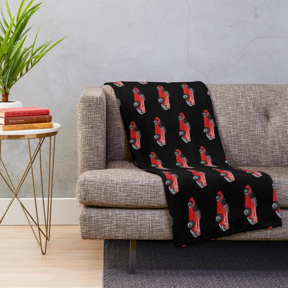 Plush blanket with a classic Triumph TR3 sports car design