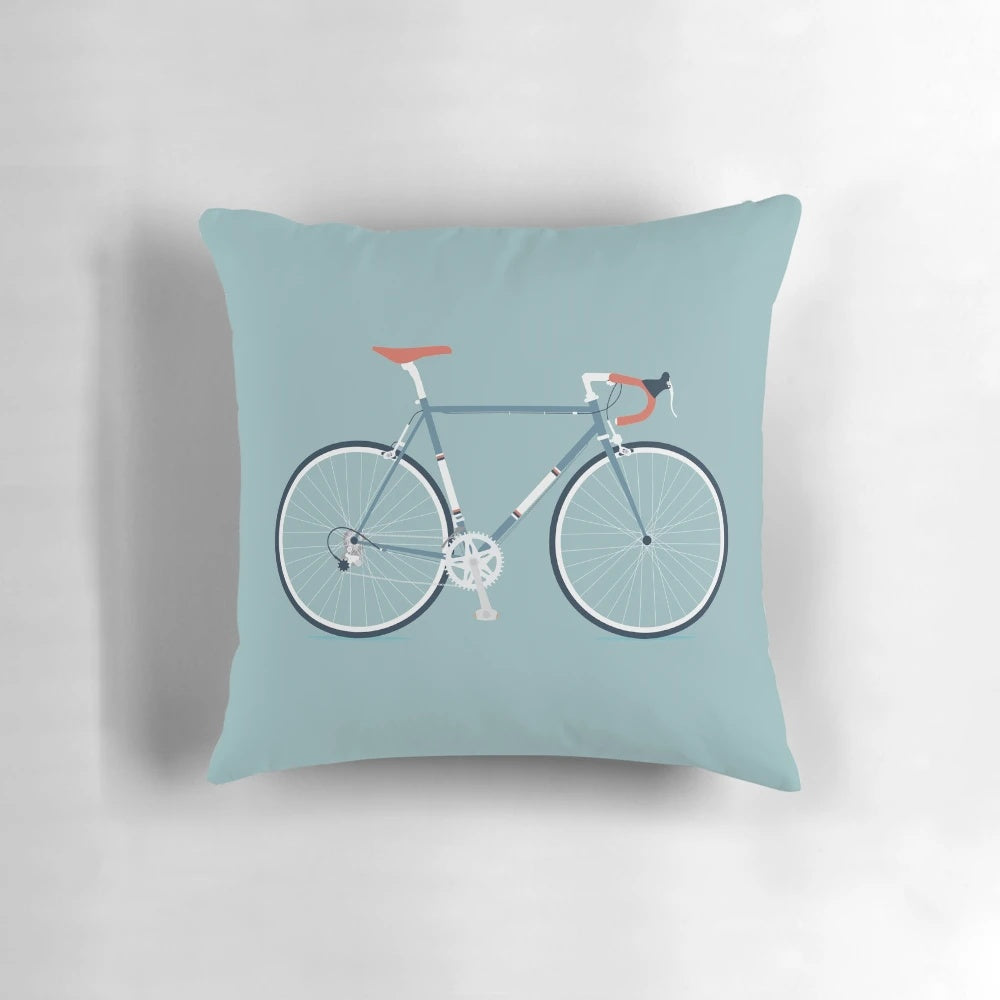 Plush road bike-style throw pillow in blue and red colors