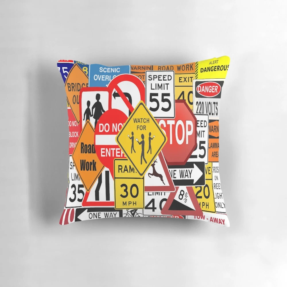 Decorative pillow featuring assorted road and traffic signs