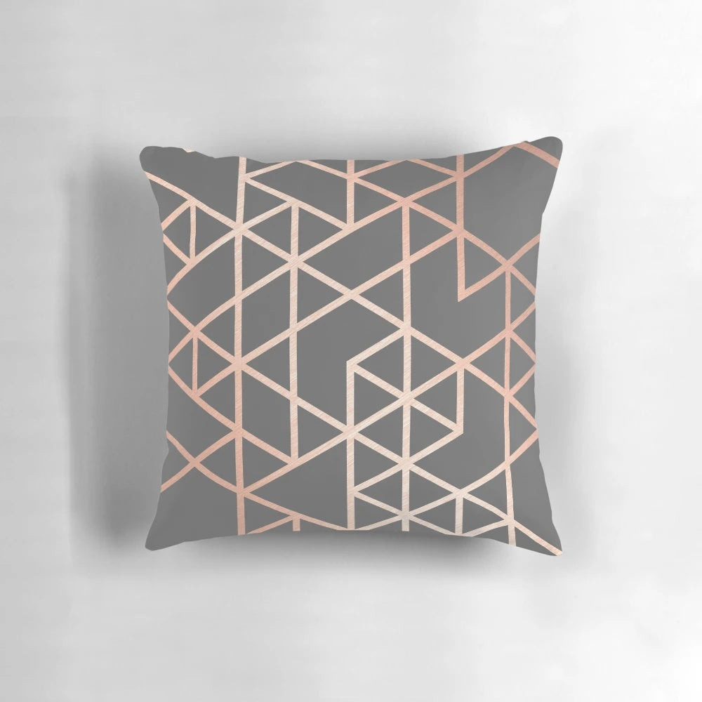 Rose gold and gray geometric patterned decorative pillow