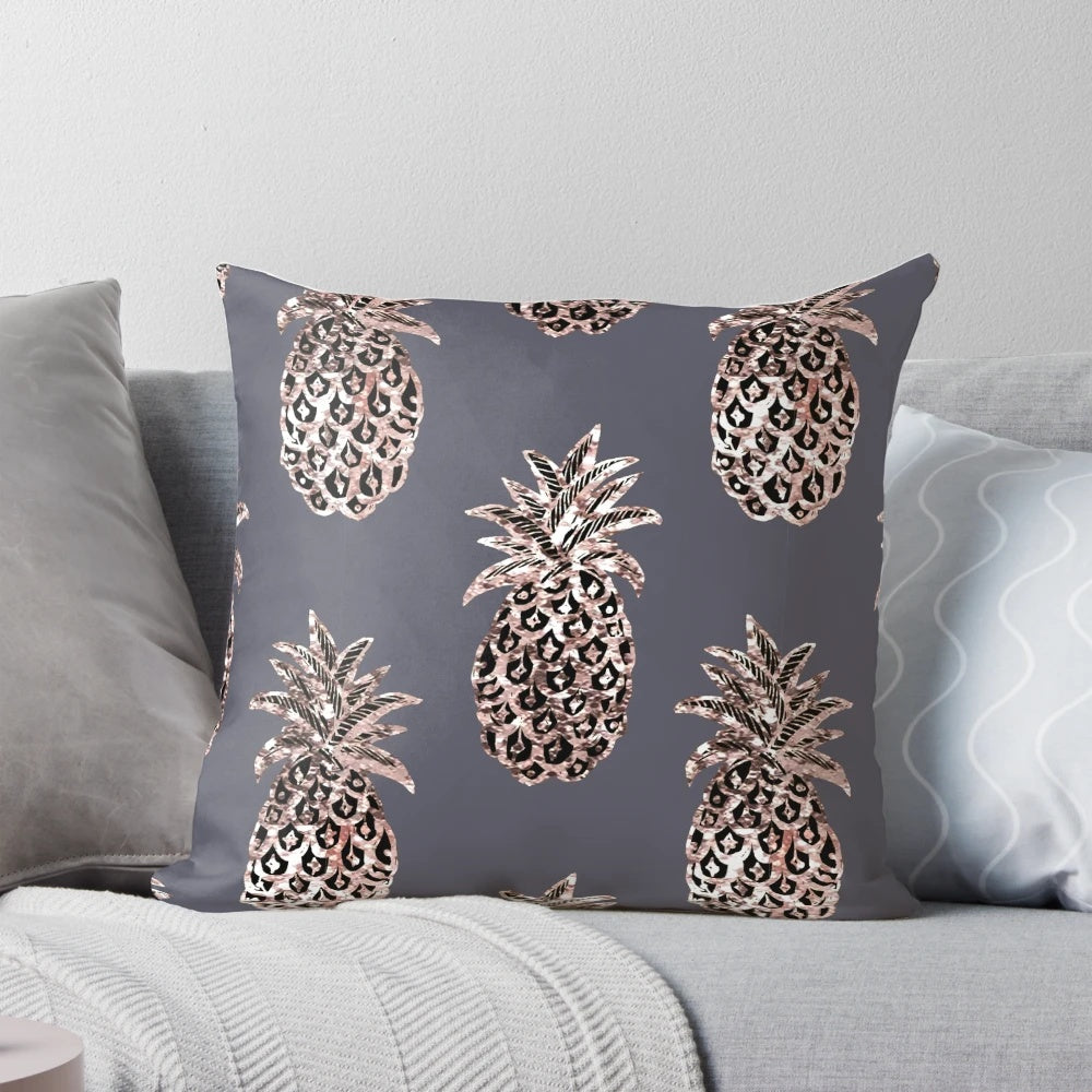 Rose gold and glitter pineapple design on a gray pillow