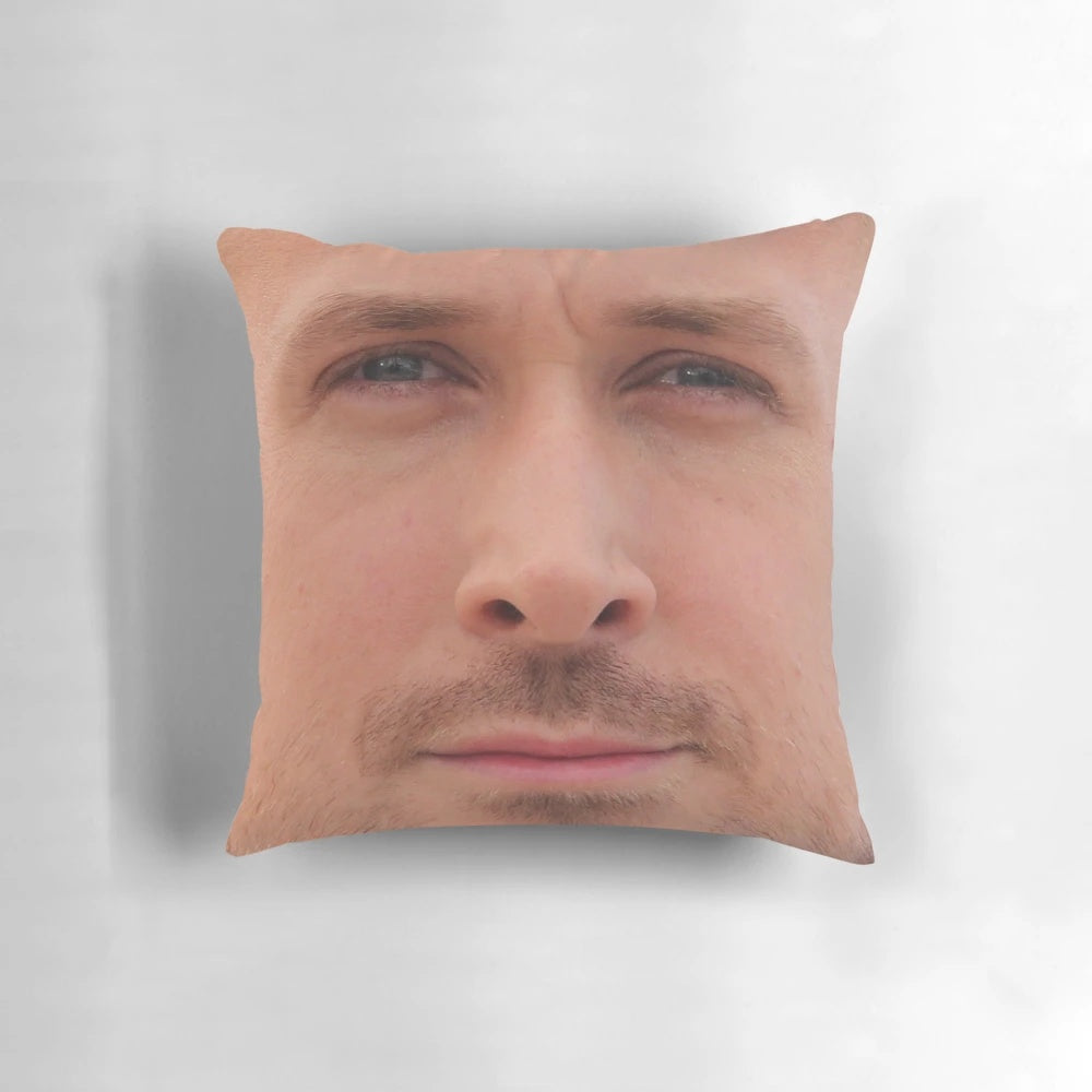 A high-quality throw pillow featuring the face of actor Ryan Gosling