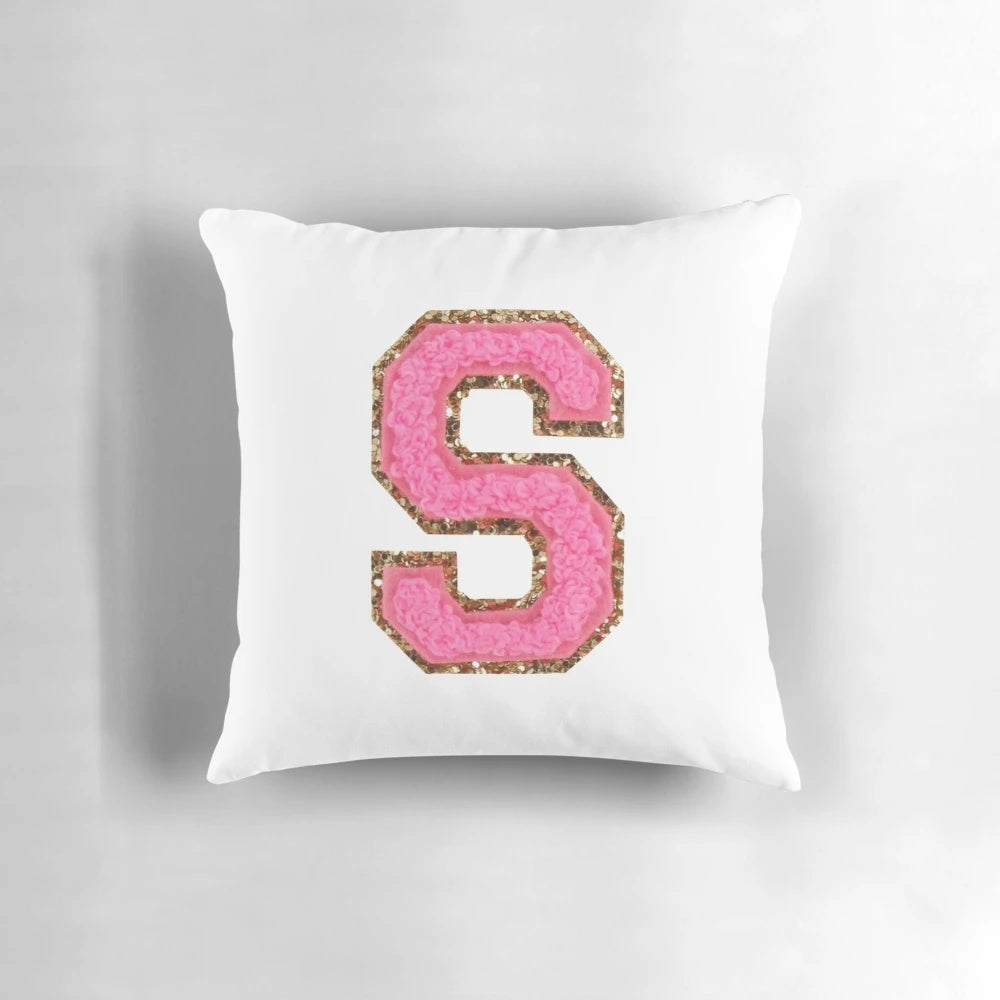 Pink "S" patch decorative pillow for modern, preppy home decor