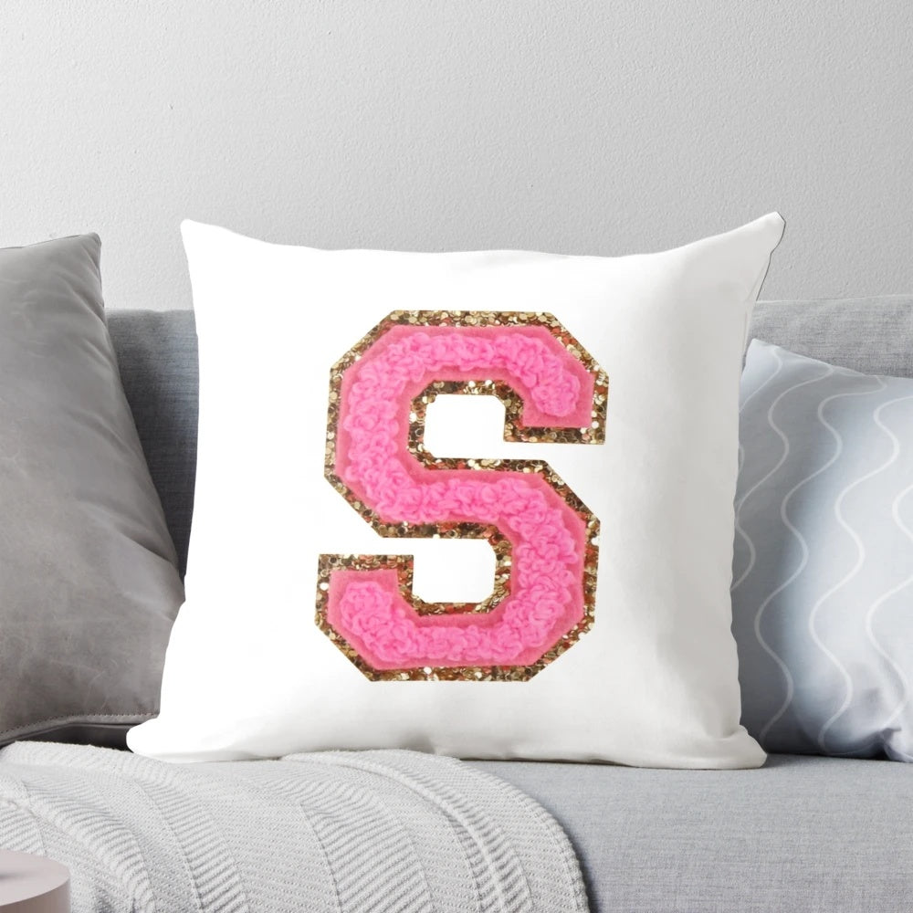 Pink "S" patch decorative pillow for modern, preppy home decor