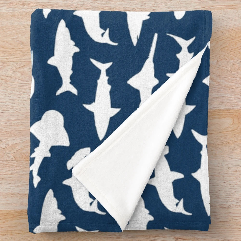 Soft and cozy plush blanket featuring elegant shark silhouettes on a navy blue background