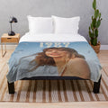 Silhouette of Taylor Swift during the 1989 album era on a plush blanket