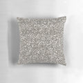 Silver glitter pillow with a textured pattern, perfect for adding a touch of glamour to any room.