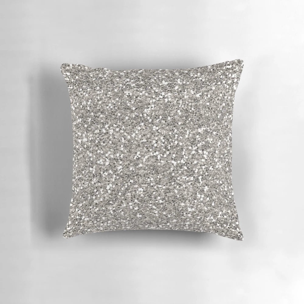 Silver glitter pillow with a textured pattern, perfect for adding a touch of glamour to any room.
