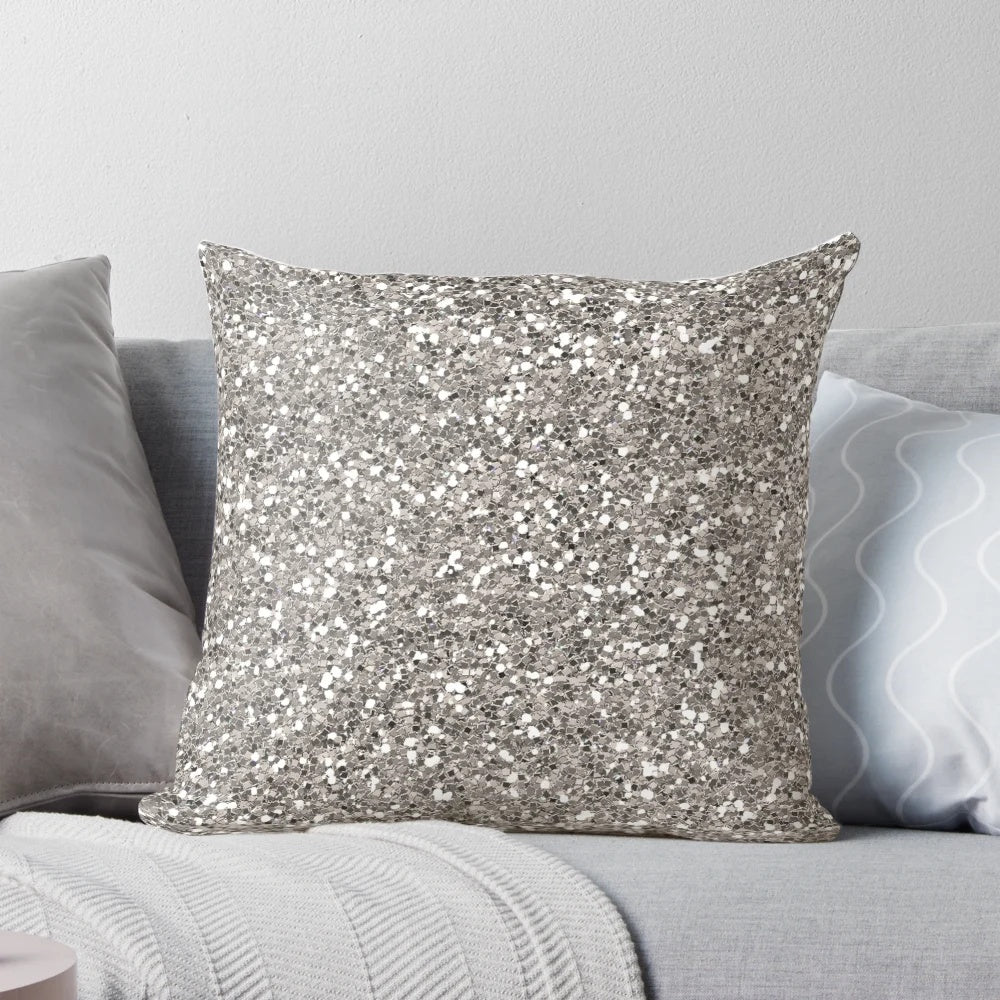 Silver glitter pillow with a textured pattern, perfect for adding a touch of glamour to any room.