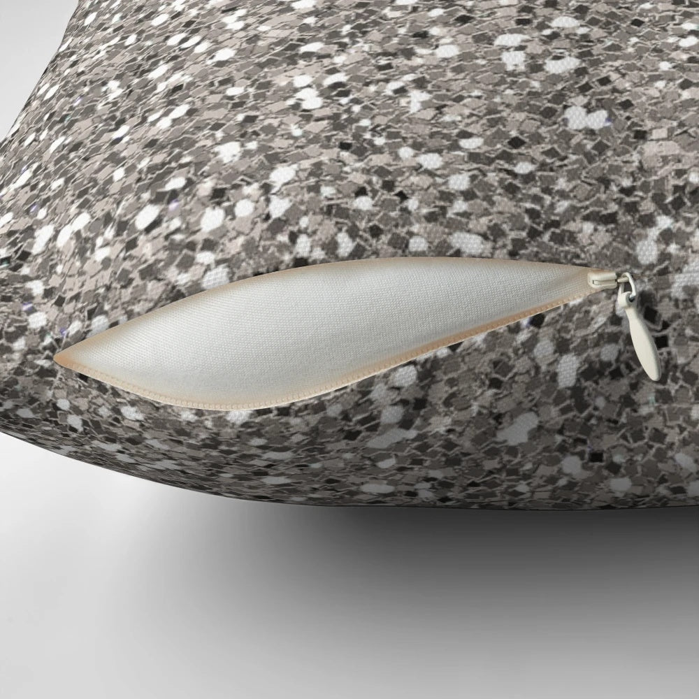 Silver glitter pillow with a textured pattern, perfect for adding a touch of glamour to any room.