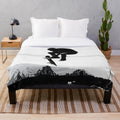 Skateboarding plush blanket featuring a flying high skater