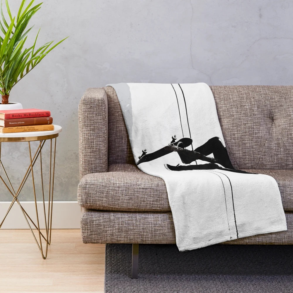 Skateboarding plush blanket featuring a flying high skater