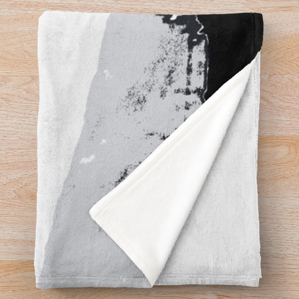 Skateboarding plush blanket featuring a flying high skater