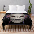 Skull space pirate plush blanket with colorful abstract patterns