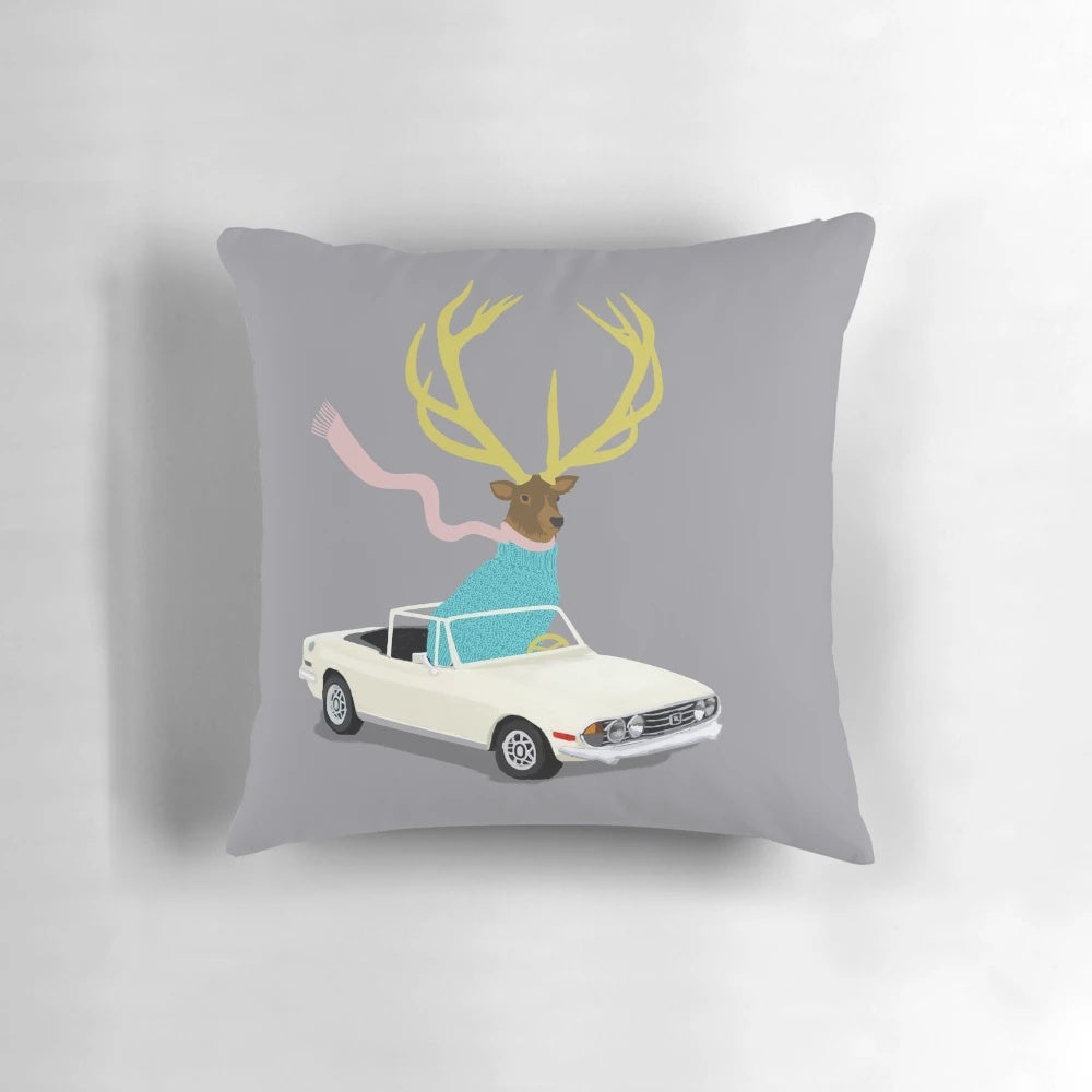 A white and grey stag-themed decorative pillow with horns