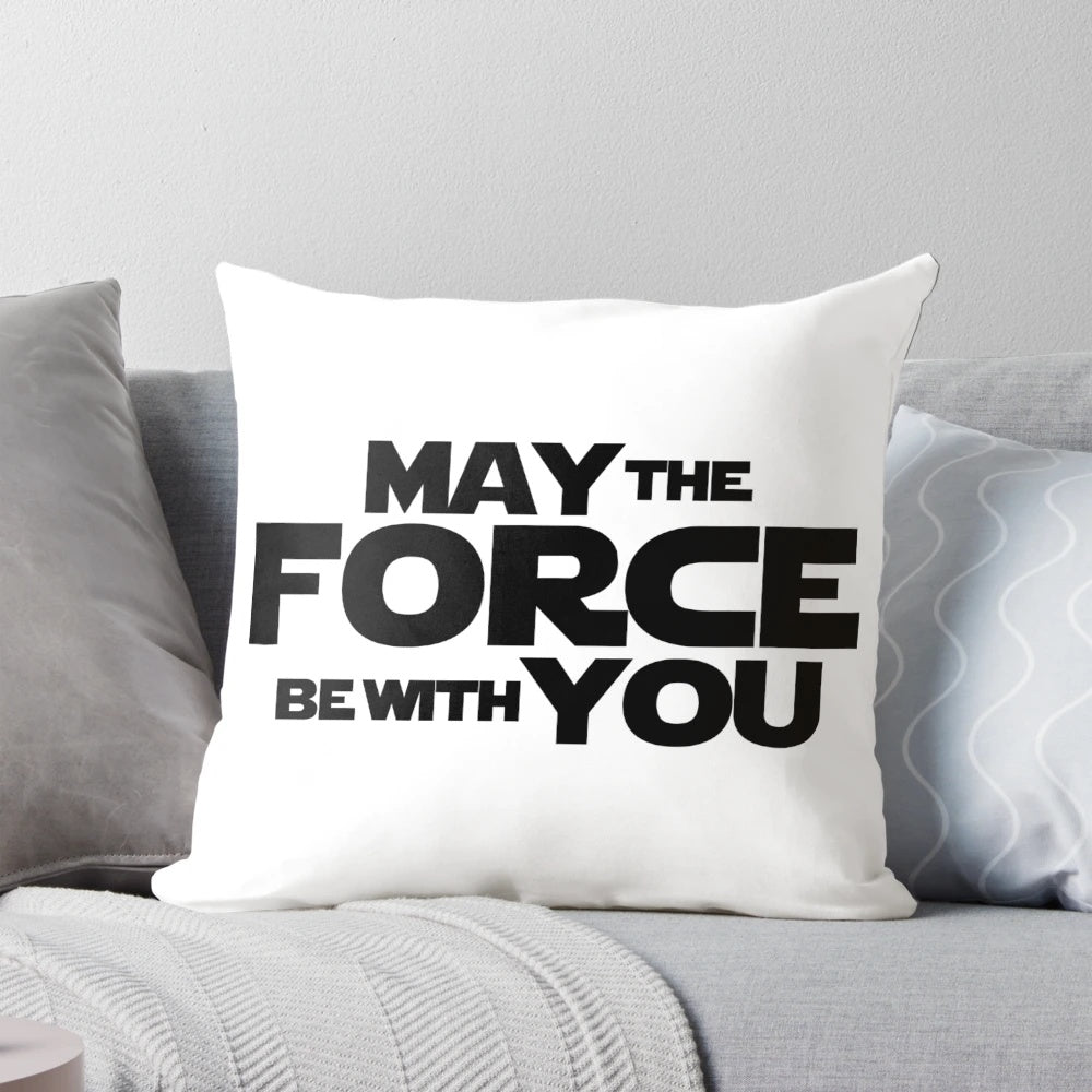 A decorative pillow featuring popular Star Wars quotes and graphics.