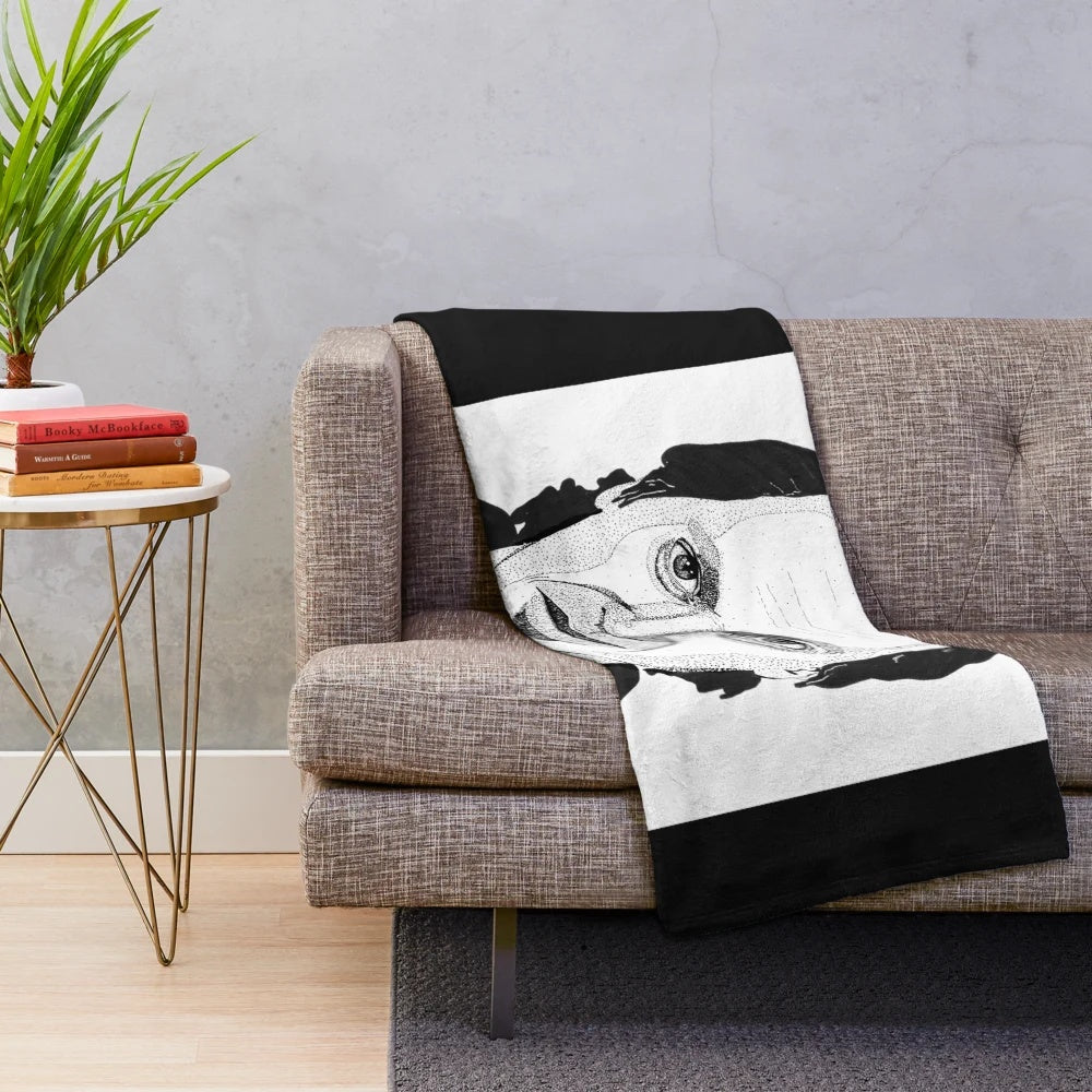 Black and white ink drawing portrait of Steve Buscemi on a plush blanket