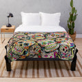 Sugar skull collage plush blanket with colorful skull designs