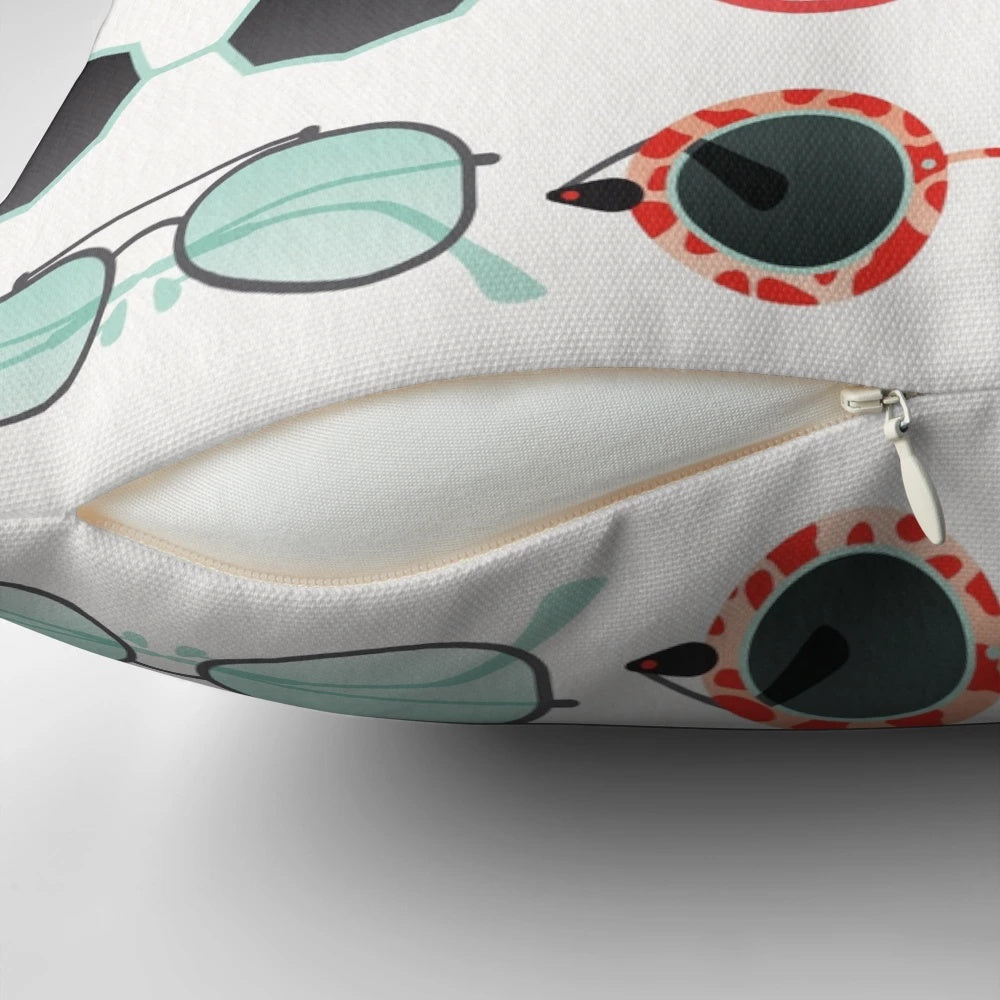 Red and mint colored decorative throw pillow with a sunglasses illustration design